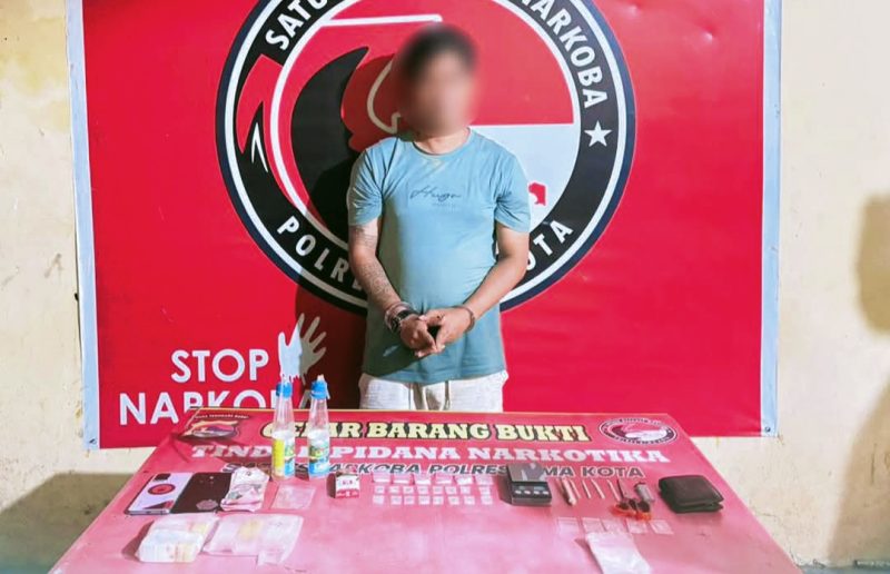 Terduga pelaku AH diketahui berprofesi sebagai wiraswasta dan berdomisili di Kelurahan Kolo, Kecamatan Asakota, Kota Bima.