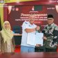 Ketua KPU Provinsi NTB Muhammad Khuwailid bersama jajaran menandatangani Perjanjian Kinerja dan Pakta Integritas Tahun 2026 yang diikuti secara luring dan daring oleh KPU Kabupaten/Kota se-NTB, Kamis (15/1/2026).