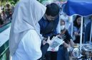 Implementasi QRIS Cross Border yang telah menjangkau lima negara untuk mendukung transaksi internasional di NTB.