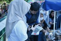 Implementasi QRIS Cross Border yang telah menjangkau lima negara untuk mendukung transaksi internasional di NTB.