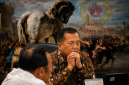 Gubernur NTB Lalu Muhamad Iqbal dengan latar ilustrasi Kuda Troya, Menggambarkan Sorotan Mi6 terhadap Dinamika Pencalonan Ketua KONI NTB Periode 2026-2030.