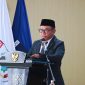 Akhdiansyah, SHI, Saat Membacakan Laporan Komisi III DPRD NTB Dalam Rapat Paripurna Terkait Konversi BPR NTB Menjadi BPRS NTB Bangkit Bersama.
