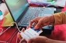 Panitia Pelaksana Melakukan Proses Identifikasi dan Verifikasi Pemilih Menggunakan Sistem E-voting Dalam Pilkades Serentak di 21 Desa Kabupaten Sumbawa Barat (KSB).