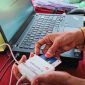 Panitia Pelaksana Melakukan Proses Identifikasi dan Verifikasi Pemilih Menggunakan Sistem E-voting Dalam Pilkades Serentak di 21 Desa Kabupaten Sumbawa Barat (KSB).